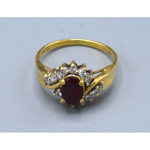 134 - An 18ct gold ring set with an oval ruby surrounded by diamonds, claw set, ring size P, 3.1g