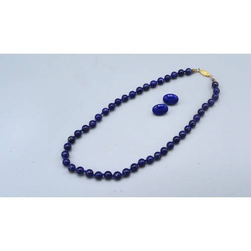 136 - A lapis lazuli bead necklace with 14ct gold clasp together with a similar pair of ear studs