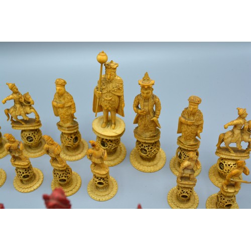 289 - An early 19th century Chinese carved ivory chess set, each piece finely carved with puzzle balls