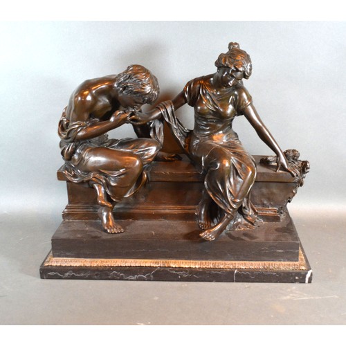 292 - A 20th century patinated bronze group in the form of two classical figures on a bench, bearing signa... 