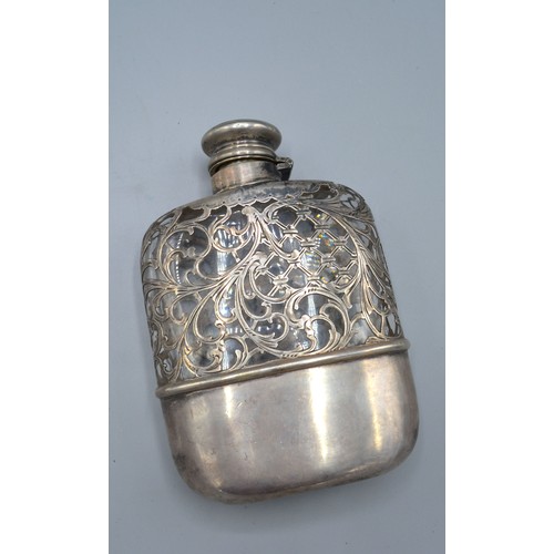 140 - A Sterling silver and glass hip flask with leather case