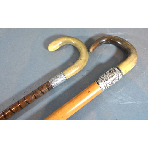 297 - A walking cane with horn handle and Chinese white metal mounts together with another similar walking... 