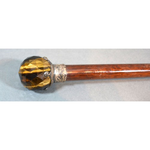 254 - An early 20th century walking cane with Tigers Eye handle, 91cms long