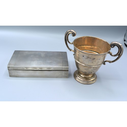 176 - A Birmingham silver two handled trophy cup, 7oz, together with a rectangular silver cigarette box, 1... 