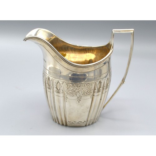 177 - A George III silver cream jug of ribbed engraved form with reeded handle, London 1800, makers Peter,... 