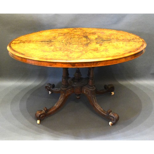 427 - A Victorian burr walnut and marquetry inlaid centre table, the moulded top above a quadruple turned ... 