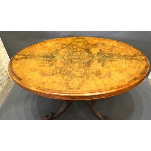 427 - A Victorian burr walnut and marquetry inlaid centre table, the moulded top above a quadruple turned ... 