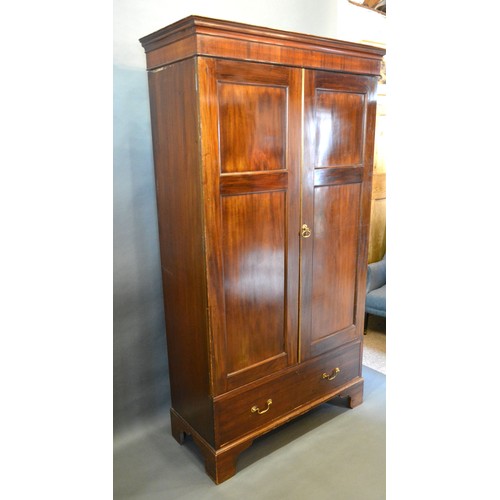 429 - A late 19th century mahogany hall cupboard, the moulded cornice above two doors above drawer raised ... 