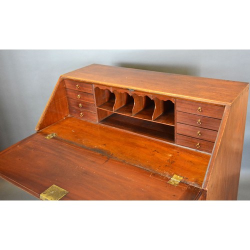 434 - A 19th century mahogany bureau, the fall front enclosing a fitted interior above four long drawers r... 