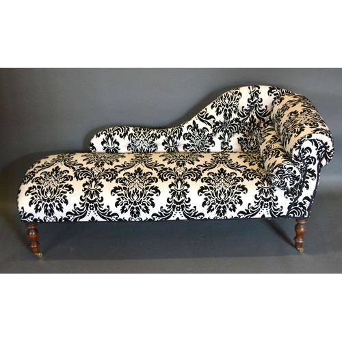 437 - A 20th century small Chaise Lounge, with scroll end and button upholstery raised upon turned legs wi... 