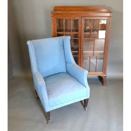 438 - A circa 1930's oak bookcase together with an Edwardian armchair