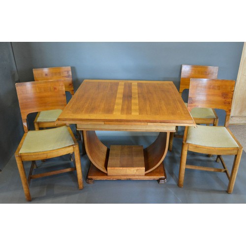 440 - An Art Deco walnut dining room suite, comprising a drawer leaf table with U stretcher together with ... 