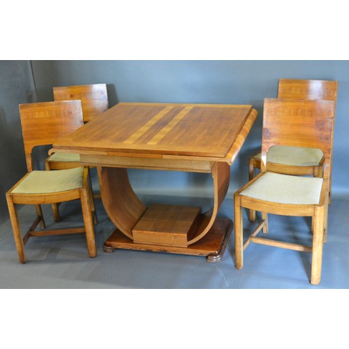 440 - An Art Deco walnut dining room suite, comprising a drawer leaf table with U stretcher together with ... 