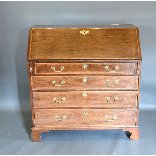 441 - A 19th century mahogany satinwood inlaid bureau, the fall front above four long drawers raised upon ... 