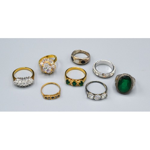 192 - An 18ct. Gold Sapphire and Diamond Ring set three sapphire and four small diamonds within a band tog... 