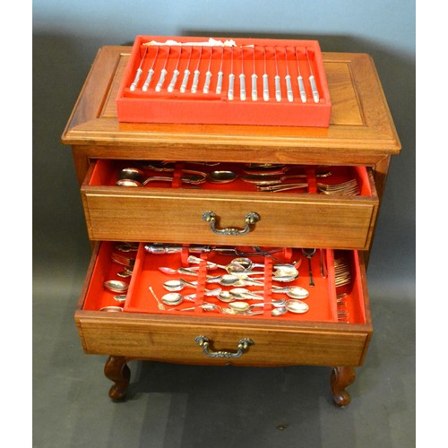 220 - A Silver Plated Canteen of Cutlery housed within a Chinese hardwood four drawer chest with brass han... 