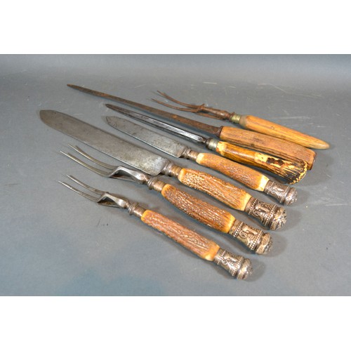 203 - A 19th Century Horn and Sheffield Silver Handled Four Piece Carving Set together with three other si... 