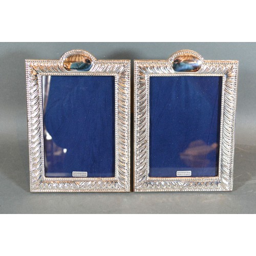 206 - A Pair of 925 Silver Photograph Frames of rectangular form 18 x 13.5 cms