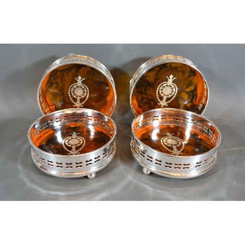 208 - A Set of Four Silver Plated and Simulated Tortoiseshell Bottle Coasters, 12.5 cms diameter
