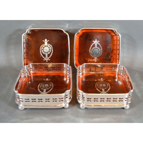 211 - A Set of Four Silver Plated and Simulated Tortoiseshell Coasters of square form 12 cms square