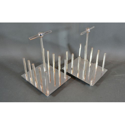 213 - A Pair of Silver Plated Four Division Toast Racks in the style of Christopher Dresser
