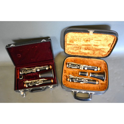 232 - A clarinet by Fairfield in case together with another similar
