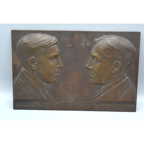 238 - An Early 19th Century Patinated Bronze Plaque decorated in relief with two busts bearing scripts dat... 