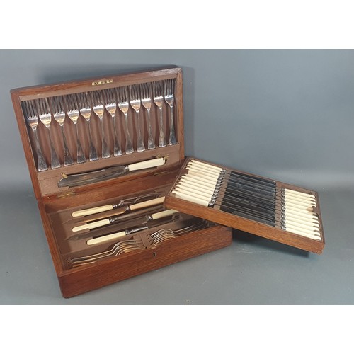 227 - A late 19th century canteen of silver plated flatware in oak case