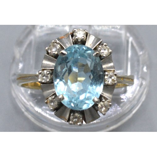 134 - A White Metal Dress Ring Set Oval Aquamarine surrounded by diamonds, 5.1 gms, ring size R