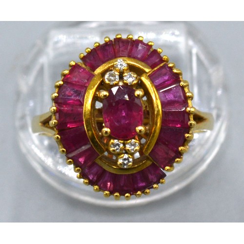 135 - An 18ct Gold Ruby And Diamond Ring set with a central oval ruby flanked by six diamonds and within b... 