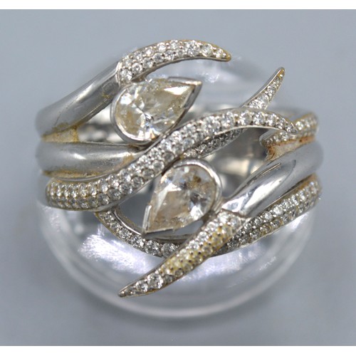 136 - An 18ct White Gold And Diamond Ring by Shaun Leane interlocking ariana ring set with two pear shaped... 