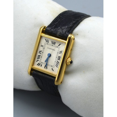 151 - A Cartier 18ct. Gold Tank 1150 Wrist Watch with leather strap and original buckle marked 750 and num... 