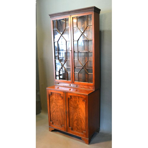 496 - A 19th Century Mahogany Bookcase, the moulded cornice above two astragal glazed doors and two drawer... 