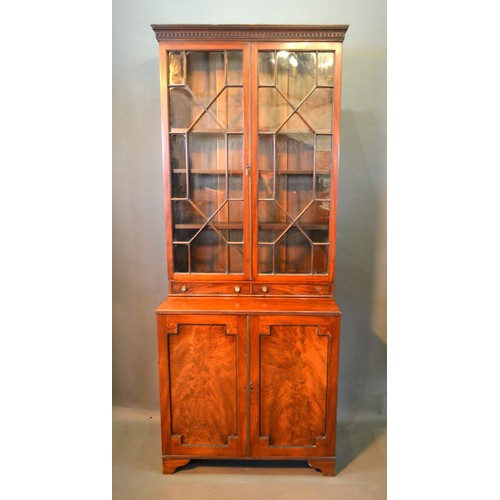 496 - A 19th Century Mahogany Bookcase, the moulded cornice above two astragal glazed doors and two drawer... 