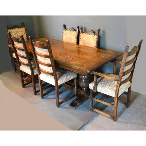 509 - A 20th Century Oak Refectory Style Dining Table with twin end bulbous legs together with a set of si... 