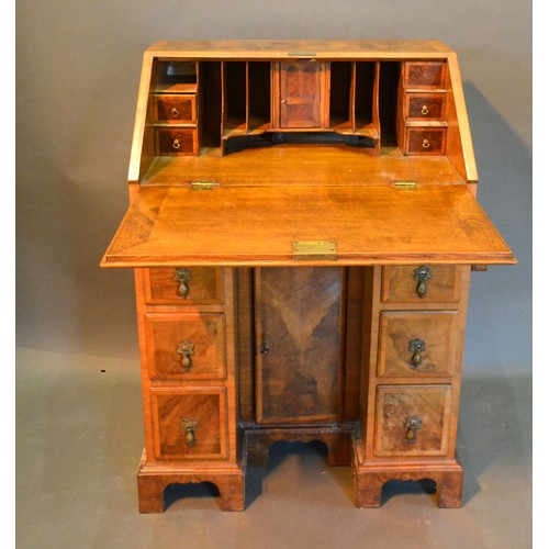 510 - A Circa 1920's Queen Anne Style Walnut Bureau, the fall front enclosing a fitted interior above seve... 