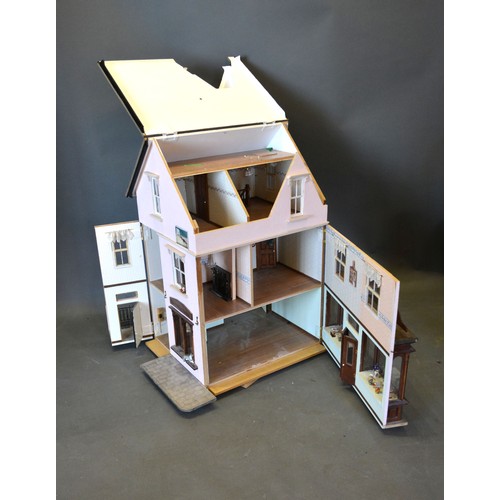 379 - A Scratch Built Dolls' House modelled as Busbridge Stores with shop front complete with a large quan... 