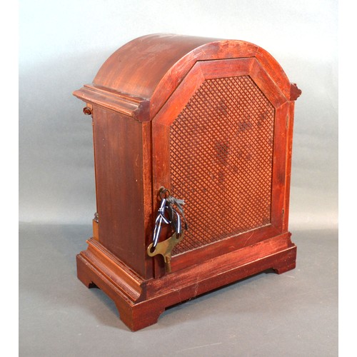 458 - A  Mahogany Mantle Clock By Gustav Becker, the dome top case with arched glazed door flanked by colu... 