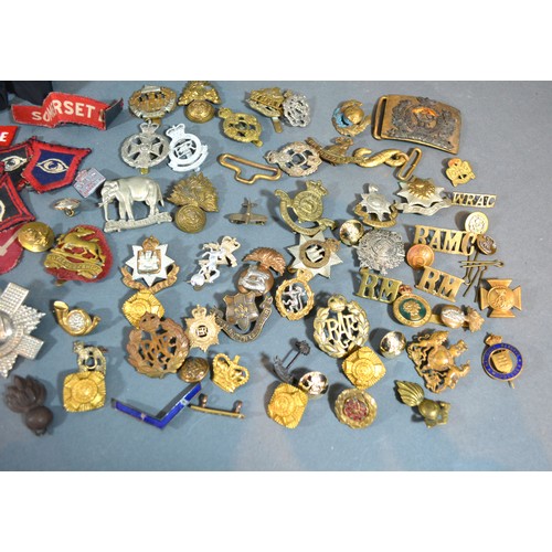 381 - A Collection Of Military Cap Badges together with a collection of military cloth badges and buttons