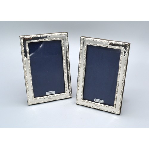 231 - A Pair Of 925 Silver Rectangular Photograph Frames 15 x 10 cms