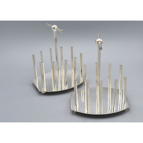 240 - A Pair Of Silver Plated Toast Racks In The Style Of Christopher Dresser 12 cms long