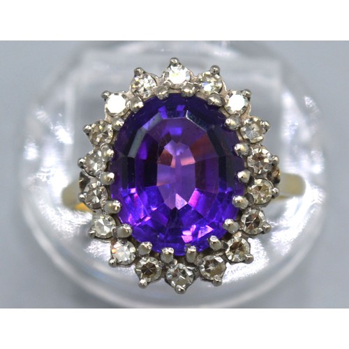 260 - An 18ct Yellow Gold Amethyst And Diamond Set Ring with large central oval amethyst surrounded by dia... 