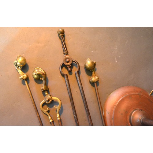 426 - A Set Of Three Brass Fire Irons with ball and claw handles together with a pair of fire tongs and a ... 