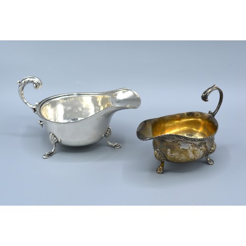 76 - A London Silver Cream Jug together with a Birmingham silver sauce jug 6 ozs.