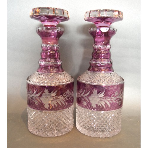 8 - A Pair Of Cut Glass And Purple Overlay Decanters With Stoppers, 28 cms tall