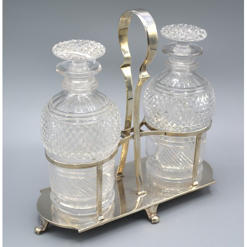 84 - A George V Silver Stand containing two cut glass decanter, Sheffield 1925, 22 ozs. 24 cms tall