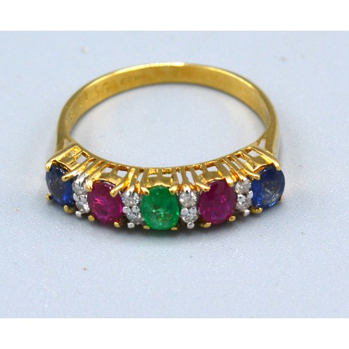 103 - An 18ct Gold Multi Gem Set Band Ring set with sapphire, ruby, emerald and diamonds 2.4 gms. ring siz... 