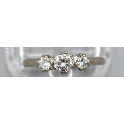 104 - An 18ct White Gold Three Stone Diamond Ring set with three graduated diamonds within a pierced setti... 