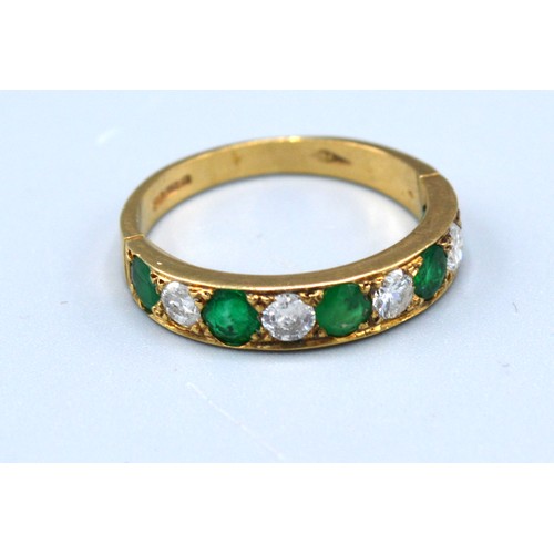 107 - A 9ct. Yellow Gold Diamond And Emerald Set Ring set with five emeralds and four diamonds, 2.2 gms. r... 