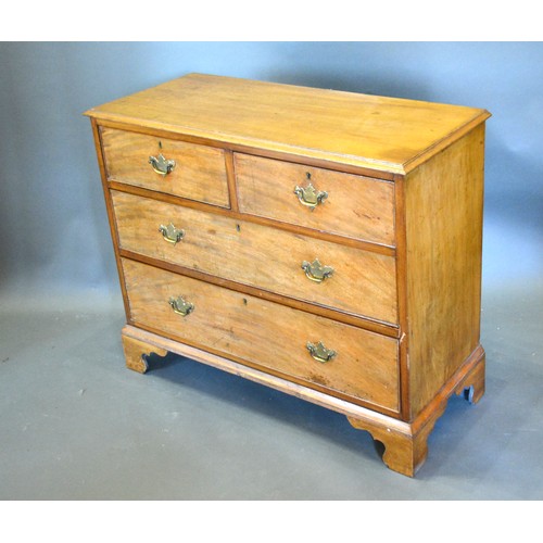 379 - A Victorian Mahogany Chest, the moulded top above two short and two long drawers with brass handles ... 